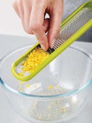 Handi-Zest grater with cleaning attachment