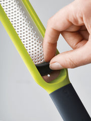 Handi-Zest grater with cleaning attachment